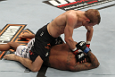 OMAHA, NE - FEBRUARY 15:  TJ Dillashaw punches down at Walel Watson on the ground during the UFC on FUEL TV event at Omaha Civic Auditorium on February 15, 2012 in Omaha, Nebraska.  (Photo by Josh Hedges/Zuffa LLC/Zuffa LLC via Getty Images) *** Local Caption *** TJ Dillashaw; Walel Watson