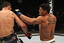 OMAHA, NE - FEBRUARY 15:  (R-L) Ronny Markes punches Aaron Simpson during the UFC on FUEL TV event at Omaha Civic Auditorium on February 15, 2012 in Omaha, Nebraska.  (Photo by Josh Hedges/Zuffa LLC/Zuffa LLC via Getty Images) *** Local Caption *** Aaron Simpson; Ronny Markes