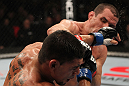 OMAHA, NE - FEBRUARY 15:  (R-L) Aaron Simpson punches Ronny Markes during the UFC on FUEL TV event at Omaha Civic Auditorium on February 15, 2012 in Omaha, Nebraska.  (Photo by Josh Hedges/Zuffa LLC/Zuffa LLC via Getty Images) *** Local Caption *** Aaron Simpson; Ronny Markes