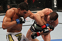 OMAHA, NE - FEBRUARY 15:  (R-L) Aaron Simpson and Ronny Markes trade punches during the UFC on FUEL TV event at Omaha Civic Auditorium on February 15, 2012 in Omaha, Nebraska.  (Photo by Josh Hedges/Zuffa LLC/Zuffa LLC via Getty Images) *** Local Caption *** Aaron Simpson; Ronny Markes