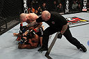 OMAHA, NE - FEBRUARY 15:  (R-L) Referee Josh Rosenthal steps in to stop the bout between Stefan Struve and Dave Herman during the UFC on FUEL TV event at Omaha Civic Auditorium on February 15, 2012 in Omaha, Nebraska.  (Photo by Josh Hedges/Zuffa LLC/Zuffa LLC via Getty Images) *** Local Caption *** Stefan Struve; Dave Herman; Josh Rosenthal