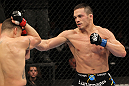 OMAHA, NE - FEBRUARY 15:  (R-L) Jake Ellenberger punches Diego Sanchez during the UFC on FUEL TV event at Omaha Civic Auditorium on February 15, 2012 in Omaha, Nebraska.  (Photo by Josh Hedges/Zuffa LLC/Zuffa LLC via Getty Images) *** Local Caption *** Jake Ellenberger; Diego Sanchez