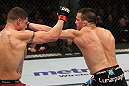 OMAHA, NE - FEBRUARY 15:  (R-L) Jake Ellenberger punches Diego Sanchez during the UFC on FUEL TV event at Omaha Civic Auditorium on February 15, 2012 in Omaha, Nebraska.  (Photo by Josh Hedges/Zuffa LLC/Zuffa LLC via Getty Images) *** Local Caption *** Jake Ellenberger; Diego Sanchez