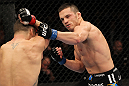OMAHA, NE - FEBRUARY 15:  (R-L) Jake Ellenberger punches Diego Sanchez during the UFC on FUEL TV event at Omaha Civic Auditorium on February 15, 2012 in Omaha, Nebraska.  (Photo by Josh Hedges/Zuffa LLC/Zuffa LLC via Getty Images) *** Local Caption *** Jake Ellenberger; Diego Sanchez