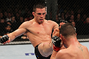 OMAHA, NE - FEBRUARY 15:  (L-R) Jake Ellenberger kicks Diego Sanchez during the UFC on FUEL TV event at Omaha Civic Auditorium on February 15, 2012 in Omaha, Nebraska.  (Photo by Josh Hedges/Zuffa LLC/Zuffa LLC via Getty Images) *** Local Caption *** Jake Ellenberger; Diego Sanchez