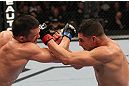 OMAHA, NE - FEBRUARY 15:  (L-R) Jake Ellenberger and Diego Sanchez trade punches during the UFC on FUEL TV event at Omaha Civic Auditorium on February 15, 2012 in Omaha, Nebraska.  (Photo by Josh Hedges/Zuffa LLC/Zuffa LLC via Getty Images) *** Local Caption *** Jake Ellenberger; Diego Sanchez