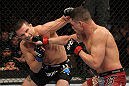 OMAHA, NE - FEBRUARY 15:  (L-R) Jake Ellenberger and Diego Sanchez trade punches during the UFC on FUEL TV event at Omaha Civic Auditorium on February 15, 2012 in Omaha, Nebraska.  (Photo by Josh Hedges/Zuffa LLC/Zuffa LLC via Getty Images) *** Local Caption *** Jake Ellenberger; Diego Sanchez