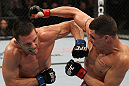 OMAHA, NE - FEBRUARY 15:  (L-R) Jake Ellenberger and Diego Sanchez trade punches during the UFC on FUEL TV event at Omaha Civic Auditorium on February 15, 2012 in Omaha, Nebraska.  (Photo by Josh Hedges/Zuffa LLC/Zuffa LLC via Getty Images) *** Local Caption *** Jake Ellenberger; Diego Sanchez