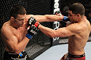 OMAHA, NE - FEBRUARY 15:  (L-R) Jake Ellenberger and Diego Sanchez trade punches during the UFC on FUEL TV event at Omaha Civic Auditorium on February 15, 2012 in Omaha, Nebraska.  (Photo by Josh Hedges/Zuffa LLC/Zuffa LLC via Getty Images) *** Local Caption *** Jake Ellenberger; Diego Sanchez