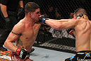 OMAHA, NE - FEBRUARY 15:  (L-R) Diego Sanchez and Jake Ellenberger trade punches during the UFC on FUEL TV event at Omaha Civic Auditorium on February 15, 2012 in Omaha, Nebraska.  (Photo by Josh Hedges/Zuffa LLC/Zuffa LLC via Getty Images) *** Local Caption *** Jake Ellenberger; Diego Sanchez