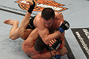 OMAHA, NE - FEBRUARY 15:  Jake Ellenberger delivers an elbow strike against Diego Sanchez during the UFC on FUEL TV event at Omaha Civic Auditorium on February 15, 2012 in Omaha, Nebraska.  (Photo by Josh Hedges/Zuffa LLC/Zuffa LLC via Getty Images) *** Local Caption *** Jake Ellenberger; Diego Sanchez