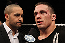 OMAHA, NE - FEBRUARY 15:  Jake Ellenberger (R) is interviewed by Jon Anik after his victory over Diego Sanchez during the UFC on FUEL TV event at Omaha Civic Auditorium on February 15, 2012 in Omaha, Nebraska.  (Photo by Josh Hedges/Zuffa LLC/Zuffa LLC via Getty Images) *** Local Caption *** Jake Ellenberger; Jon Anik