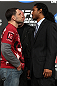 TOKYO, JAPAN - FEBRUARY 23:  (L-R) UFC Lightweight Champion Frankie Edgar and challenger Benson Henderson face off at the final UFC 144 pre-fight press conference at the Ritz-Carlton Hotel on February 23, 2012 in Tokyo, Japan.  (Photo by Josh Hedges/Zuffa LLC/Zuffa LLC via Getty Images) *** Local Caption *** Frankie Edgar; Benson Henderson