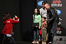 SAITAMA, JAPAN - FEBRUARY 25:  UFC Welterweight Champion Georges St-Pierre poses for photos with fans before the official UFC 144 weigh in at the Saitama Super Arena on February 25, 2012 in Saitama, Japan.  (Photo by Josh Hedges/Zuffa LLC/Zuffa LLC via Getty Images) *** Local Caption *** Georges St-Pierre