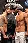 SAITAMA, JAPAN - FEBRUARY 25:  (L-R) UFC Lightweight Champion Frankie Edgar and challenger Benson Henderson face off after weighing in during the official UFC 144 weigh in at the Saitama Super Arena on February 25, 2012 in Saitama, Japan.  (Photo by Josh Hedges/Zuffa LLC/Zuffa LLC via Getty Images) *** Local Caption *** Benson Henderson; Frankie Edgar