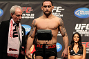 SAITAMA, JAPAN - FEBRUARY 25:  UFC Lightweight Champion Frankie Edgar weighs in during the official UFC 144 weigh in at the Saitama Super Arena on February 25, 2012 in Saitama, Japan.  (Photo by Josh Hedges/Zuffa LLC/Zuffa LLC via Getty Images) *** Local Caption *** Frankie Edgar