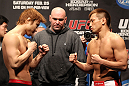 SAITAMA, JAPAN - FEBRUARY 25:  (L-R) Lightweight opponents Takanori Gomi and Eiji Mitsuoka face off after weighing in during the official UFC 144 weigh in at the Saitama Super Arena on February 25, 2012 in Saitama, Japan.  (Photo by Josh Hedges/Zuffa LLC/Zuffa LLC via Getty Images) *** Local Caption *** Takanori Gomi; Eiji Mitsuoka