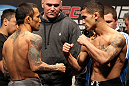 SAITAMA, JAPAN - FEBRUARY 25:  (L-R) Bantamweight opponents Norifumi "Kid" Yamamoto and Vaughn Lee face off after weighing in during the official UFC 144 weigh in at the Saitama Super Arena on February 25, 2012 in Saitama, Japan.  (Photo by Josh Hedges/Zuffa LLC/Zuffa LLC via Getty Images) *** Local Caption *** Norifumi Yamamoto; Vaughn Lee