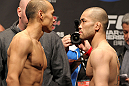 SAITAMA, JAPAN - FEBRUARY 25:  (L-R) Opponents Tiequan Zhang and Issei Tamura face off after weighing in during the official UFC 144 weigh in at the Saitama Super Arena on February 25, 2012 in Saitama, Japan.  (Photo by Josh Hedges/Zuffa LLC/Zuffa LLC via Getty Images) *** Local Caption *** Tiequan Zhang; Issei Tamura