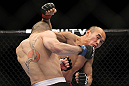 SAITAMA, JAPAN - FEBRUARY 26:  (R-L) Tiequan Zhang punches Issei Tamura during the UFC 144 event at Saitama Super Arena on February 26, 2012 in Saitama, Japan.  (Photo by Josh Hedges/Zuffa LLC/Zuffa LLC via Getty Images) *** Local Caption *** Tiequan Zhang; Issei Tamura