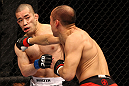 SAITAMA, JAPAN - FEBRUARY 26:  (R-L) Tiequan Zhang punches Issei Tamura during the UFC 144 event at Saitama Super Arena on February 26, 2012 in Saitama, Japan.  (Photo by Al Bello/Zuffa LLC/Zuffa LLC via Getty Images) *** Local Caption *** Tiequan Zhang; Issei Tamura