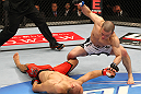 SAITAMA, JAPAN - FEBRUARY 26:  (R-L) Issei Tamura knocks out Tiequan Zhang with a punch on the ground during the UFC 144 event at Saitama Super Arena on February 26, 2012 in Saitama, Japan.  (Photo by Al Bello/Zuffa LLC/Zuffa LLC via Getty Images) *** Local Caption *** Tiequan Zhang; Issei Tamura