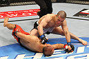 SAITAMA, JAPAN - FEBRUARY 26:  (R-L) Issei Tamura knocks out Tiequan Zhang with a punch on the ground during the UFC 144 event at Saitama Super Arena on February 26, 2012 in Saitama, Japan.  (Photo by Al Bello/Zuffa LLC/Zuffa LLC via Getty Images) *** Local Caption *** Tiequan Zhang; Issei Tamura