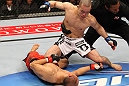SAITAMA, JAPAN - FEBRUARY 26:  (R-L) Issei Tamura knocks out Tiequan Zhang with a punch on the ground during the UFC 144 event at Saitama Super Arena on February 26, 2012 in Saitama, Japan.  (Photo by Al Bello/Zuffa LLC/Zuffa LLC via Getty Images) *** Local Caption *** Tiequan Zhang; Issei Tamura