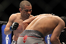 SAITAMA, JAPAN - FEBRUARY 26:  (L-R) Chris Cariaso punches Takeya Mizugaki during the UFC 144 event at Saitama Super Arena on February 26, 2012 in Saitama, Japan.  (Photo by Josh Hedges/Zuffa LLC/Zuffa LLC via Getty Images) *** Local Caption *** Takeya Mizugaki; Chris Cariaso