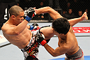 SAITAMA, JAPAN - FEBRUARY 26:  (L-R) Chris Cariaso and Takeya Mizugaki trade strikes during the UFC 144 event at Saitama Super Arena on February 26, 2012 in Saitama, Japan.  (Photo by Al Bello/Zuffa LLC/Zuffa LLC via Getty Images) *** Local Caption *** Takeya Mizugaki; Chris Cariaso