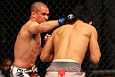 SAITAMA, JAPAN - FEBRUARY 26:  (L-R) Chris Cariaso punches Takeya Mizugaki during the UFC 144 event at Saitama Super Arena on February 26, 2012 in Saitama, Japan.  (Photo by Al Bello/Zuffa LLC/Zuffa LLC via Getty Images) *** Local Caption *** Takeya Mizugaki; Chris Cariaso