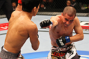 SAITAMA, JAPAN - FEBRUARY 26:  (R-L) Chris Cariaso punches Takeya Mizugaki during the UFC 144 event at Saitama Super Arena on February 26, 2012 in Saitama, Japan.  (Photo by Al Bello/Zuffa LLC/Zuffa LLC via Getty Images) *** Local Caption *** Takeya Mizugaki; Chris Cariaso