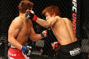 SAITAMA, JAPAN - FEBRUARY 26:  (R-L) Takanori Gomi punches Eiji Mitsuoka during the UFC 144 event at Saitama Super Arena on February 26, 2012 in Saitama, Japan.  (Photo by Al Bello/Zuffa LLC/Zuffa LLC via Getty Images) *** Local Caption *** Takanori Gomi; Eiji Mitsuoka