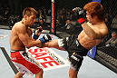 SAITAMA, JAPAN - FEBRUARY 26:  (R-L) Takanori Gomi kicks Eiji Mitsuoka during the UFC 144 event at Saitama Super Arena on February 26, 2012 in Saitama, Japan.  (Photo by Al Bello/Zuffa LLC/Zuffa LLC via Getty Images) *** Local Caption *** Takanori Gomi; Eiji Mitsuoka