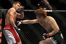 SAITAMA, JAPAN - FEBRUARY 26:  (R-L) Takanori Gomi punches Eiji Mitsuoka during the UFC 144 event at Saitama Super Arena on February 26, 2012 in Saitama, Japan.  (Photo by Josh Hedges/Zuffa LLC/Zuffa LLC via Getty Images) *** Local Caption *** Takanori Gomi; Eiji Mitsuoka
