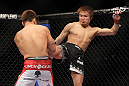 SAITAMA, JAPAN - FEBRUARY 26:  (R-L) Takanori Gomi kicks Eiji Mitsuoka during the UFC 144 event at Saitama Super Arena on February 26, 2012 in Saitama, Japan.  (Photo by Josh Hedges/Zuffa LLC/Zuffa LLC via Getty Images) *** Local Caption *** Takanori Gomi; Eiji Mitsuoka