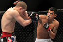 SAITAMA, JAPAN - FEBRUARY 26:  (R-L) Anthony Pettis punches Joe Lauzon during the UFC 144 event at Saitama Super Arena on February 26, 2012 in Saitama, Japan.  (Photo by Josh Hedges/Zuffa LLC/Zuffa LLC via Getty Images) *** Local Caption *** Anthony Pettis; Joe Lauzon