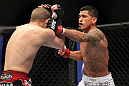 SAITAMA, JAPAN - FEBRUARY 26:  (R-L) Anthony Pettis punches Joe Lauzon during the UFC 144 event at Saitama Super Arena on February 26, 2012 in Saitama, Japan.  (Photo by Josh Hedges/Zuffa LLC/Zuffa LLC via Getty Images) *** Local Caption *** Anthony Pettis; Joe Lauzon