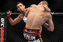 SAITAMA, JAPAN - FEBRUARY 26:  (L-R) Anthony Pettis knocks out Joe Lauzon with a kick during the UFC 144 event at Saitama Super Arena on February 26, 2012 in Saitama, Japan.  (Photo by Josh Hedges/Zuffa LLC/Zuffa LLC via Getty Images) *** Local Caption *** Anthony Pettis; Joe Lauzon