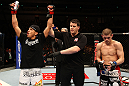 SAITAMA, JAPAN - FEBRUARY 26:  Anthony Pettis (L) reacts after knocking out Joe Lauzon during the UFC 144 event at Saitama Super Arena on February 26, 2012 in Saitama, Japan.  (Photo by Al Bello/Zuffa LLC/Zuffa LLC via Getty Images) *** Local Caption *** Anthony Pettis; Joe Lauzon