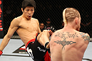 SAITAMA, JAPAN - FEBRUARY 26:  (L-R) Hatsu Hioki kicks Bart Palaszewski during the UFC 144 event at Saitama Super Arena on February 26, 2012 in Saitama, Japan.  (Photo by Al Bello/Zuffa LLC/Zuffa LLC via Getty Images) *** Local Caption *** Hatsu Hioki; Bart Palaszewski