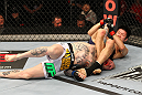 SAITAMA, JAPAN - FEBRUARY 26:  (R-L) Hatsu Hioki attempts an arm bar submission against Bart Palaszewski during the UFC 144 event at Saitama Super Arena on February 26, 2012 in Saitama, Japan.  (Photo by Al Bello/Zuffa LLC/Zuffa LLC via Getty Images) *** Local Caption *** Hatsu Hioki; Bart Palaszewski