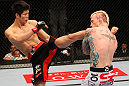 SAITAMA, JAPAN - FEBRUARY 26:  (L-R) Hatsu Hioki kicks Bart Palaszewski during the UFC 144 event at Saitama Super Arena on February 26, 2012 in Saitama, Japan.  (Photo by Al Bello/Zuffa LLC/Zuffa LLC via Getty Images) *** Local Caption *** Hatsu Hioki; Bart Palaszewski