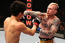 SAITAMA, JAPAN - FEBRUARY 26:  (R-L) Bart Palaszewski punches Hatsu Hioki during the UFC 144 event at Saitama Super Arena on February 26, 2012 in Saitama, Japan.  (Photo by Al Bello/Zuffa LLC/Zuffa LLC via Getty Images) *** Local Caption *** Hatsu Hioki; Bart Palaszewski