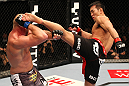 SAITAMA, JAPAN - FEBRUARY 26:  (R-L) Yushin Okami kicks Tim Boetsch during the UFC 144 event at Saitama Super Arena on February 26, 2012 in Saitama, Japan.  (Photo by Al Bello/Zuffa LLC/Zuffa LLC via Getty Images) *** Local Caption *** Yushin Okami; Tim Boetsch