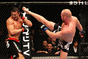 SAITAMA, JAPAN - FEBRUARY 26:  (R-L) Tim Boetsch kicks Yushin Okami during the UFC 144 event at Saitama Super Arena on February 26, 2012 in Saitama, Japan.  (Photo by Al Bello/Zuffa LLC/Zuffa LLC via Getty Images) *** Local Caption *** Yushin Okami; Tim Boetsch