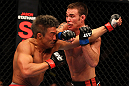 SAITAMA, JAPAN - FEBRUARY 26:  (R-L) Jake Shields punches Yoshihiro Akiyama during the UFC 144 event at Saitama Super Arena on February 26, 2012 in Saitama, Japan.  (Photo by Al Bello/Zuffa LLC/Zuffa LLC via Getty Images) *** Local Caption *** Yoshihiro Akiyama; Jake Shields