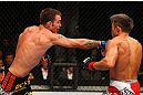 SAITAMA, JAPAN - FEBRUARY 26:  (L-R) Jake Shields punches Yoshihiro Akiyama during the UFC 144 event at Saitama Super Arena on February 26, 2012 in Saitama, Japan.  (Photo by Al Bello/Zuffa LLC/Zuffa LLC via Getty Images) *** Local Caption *** Yoshihiro Akiyama; Jake Shields