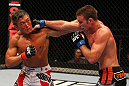 SAITAMA, JAPAN - FEBRUARY 26:  (L-R) Yoshihiro Akiyama and Jake Shields trade punches during the UFC 144 event at Saitama Super Arena on February 26, 2012 in Saitama, Japan.  (Photo by Al Bello/Zuffa LLC/Zuffa LLC via Getty Images) *** Local Caption *** Yoshihiro Akiyama; Jake Shields