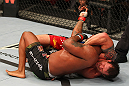 SAITAMA, JAPAN - FEBRUARY 26:  (R-L) Ryan Bader attempts a guillotine choke against Quinton "Rampage" Jackson during the UFC 144 event at Saitama Super Arena on February 26, 2012 in Saitama, Japan.  (Photo by Al Bello/Zuffa LLC/Zuffa LLC via Getty Images) *** Local Caption *** Quinton Jackson; Ryan Bader